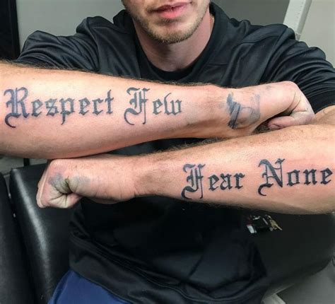 Fear No Man: Bold Arm Tattoo Design